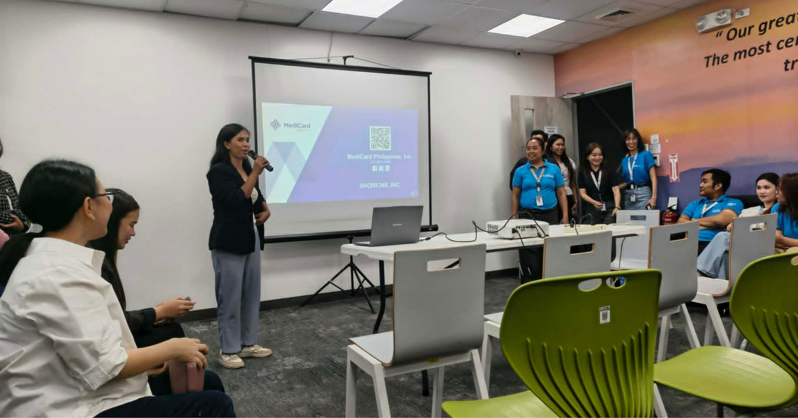 Employees attending an HMO orientation in the workplace, representing employer-provided healthcare benefits and helping workers understand their medical coverage and wellness support.